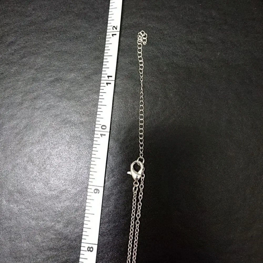 Silver tone and pink stone necklace